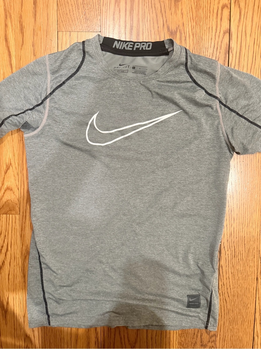 Nike Gray Short Sleeve Dri-Fit Performance Tee with White Swoosh